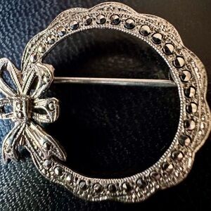 UNIQUE ANTIQUE STERLING SILVER AND MARCASITE BOW PIN BROOCH